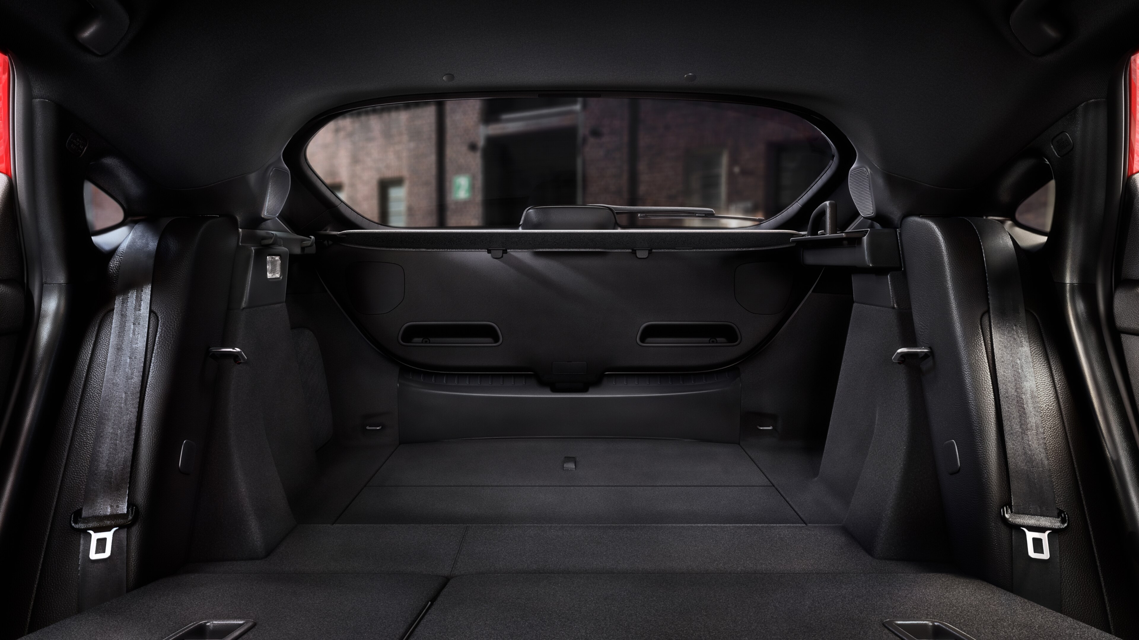 View out the open rear door of a Honda Civic Hatchback with back seats down