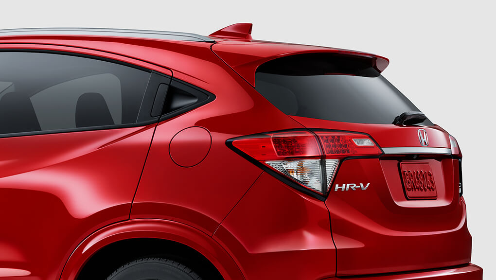 Close-up taillights on 2022 Honda HR-V in red. 