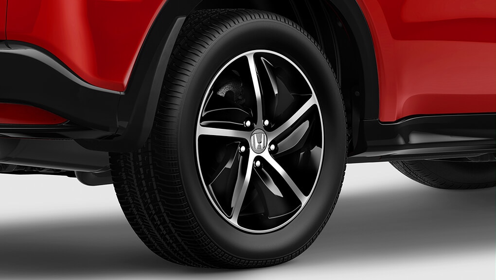 Close-up of wheels on 2022 Honda HR-V in red.